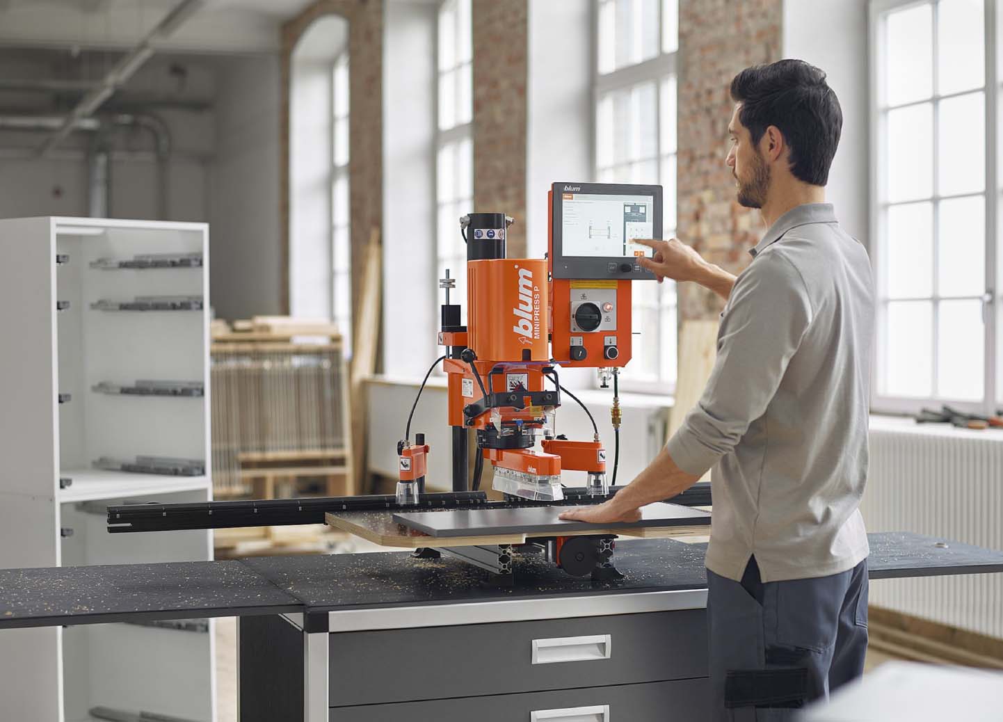 One man operating the Blum EASYSTICK in workshop